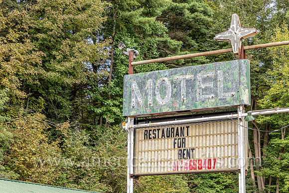Old fashioned ghost sign for “Motel” at an abandoned motel and restaurant at Pond Eddy in Sullivan County, New York.