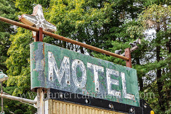 Old fashioned ghost sign for “Motel” at an abandoned motel and restaurant at Pond Eddy in Sullivan County, New York.