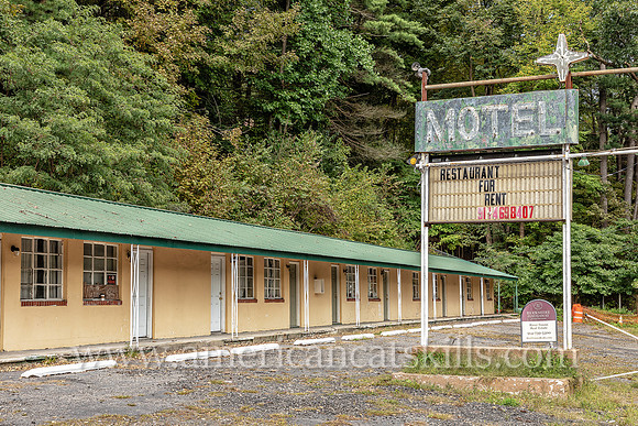 Old fashioned ghost sign for “Motel” at an abandoned motel and restaurant at Pond Eddy in Sullivan County, New York.