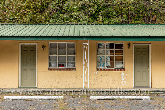 Old fashioned ghost sign for “Motel” at an abandoned motel and restaurant at Pond Eddy in Sullivan County, New York.