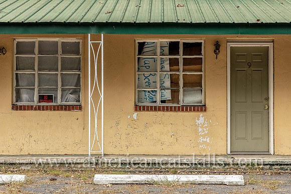 Old fashioned ghost sign for “Motel” at an abandoned motel and restaurant at Pond Eddy in Sullivan County, New York.