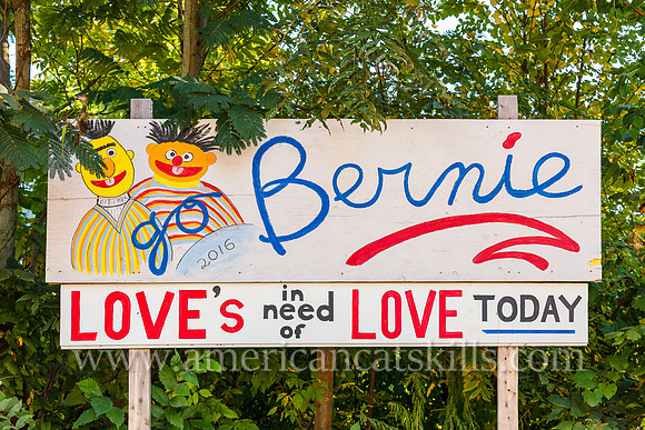 Billboard supporting 2016 Presidential candidate Bernie Sanders; with pictures of Sesame Street characters Bert and Ernie; with the words “Love’s in Need of Love Today.”