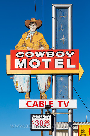 Vintage sign depicting an old-fashioned cowboy while advertising for the Cowboy Motel, an historic motor court located along Route 66 (East Amarillo Boulevard) in the city of Amarillo, Texas.