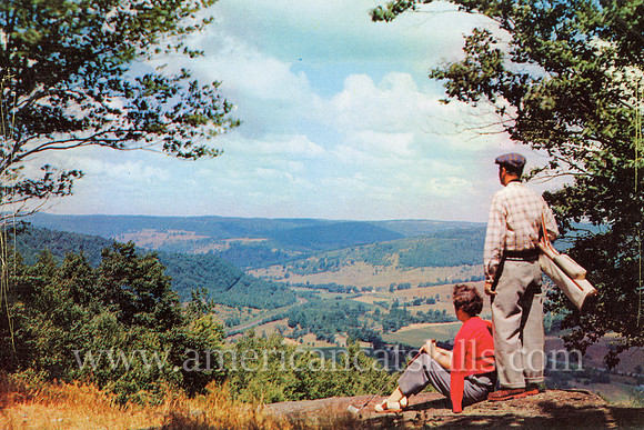 Vintage postcard by photographer Bob Wyer titled "Sunset Rock at Oquaga Lake."