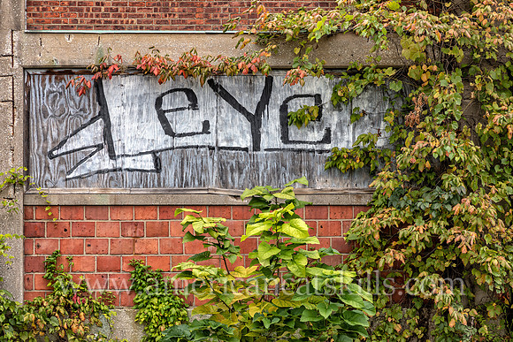 Graffiti of the word “Eye” on the outside of the abandoned factory of B. Millens & Sons in the Rondout District of Kingston, New York.
