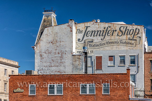 Mural and ghost sign advertisement for The Jennifer Shop on the Clermont Building in the Stockade District of Kingston, New York.