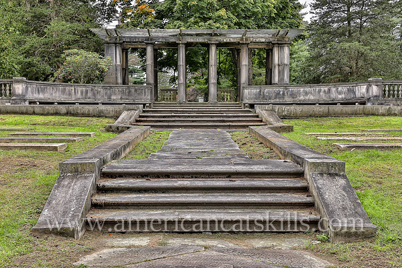 Family plot for the Coykendall family that includes a pergola, stone steps and stone walls at the Montrepose Cemetery in Kingston, New York.