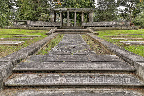 Family plot for the Coykendall family that includes a pergola, stone steps and stone walls at the Montrepose Cemetery in Kingston, New York.