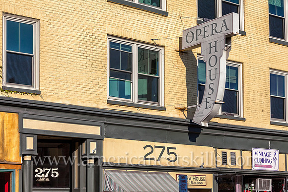 The Opera House building, with a vintage sign on the façade, is located in the Stockade District of Kingston, New York.