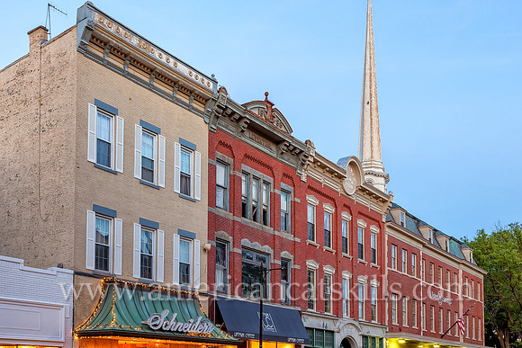The steeple of the Old Dutch Church in the Stockade District of Kingston, New York rises above Schneider’s Jewelry and the Ulster Savings Bank.