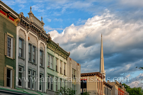 The steeple of the Old Dutch Church rises above the beautiful architecture of Wall Street in the Stockade District of Kingston, New York.