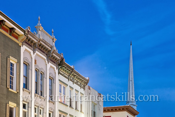The steeple of the Old Dutch Church rises above the beautiful architecture of Wall Street in the Stockade District of Kingston, New York.