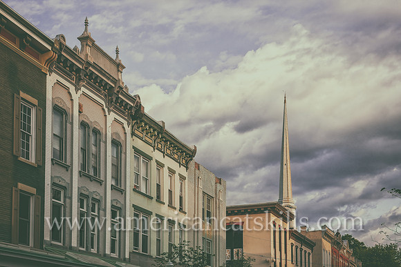 The steeple of the Old Dutch Church rises above the beautiful architecture of Wall Street in the Stockade District of Kingston, New York.