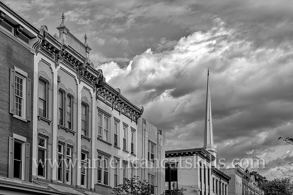 The steeple of the Old Dutch Church rises above the beautiful architecture of Wall Street in the Stockade District of Kingston, New York.