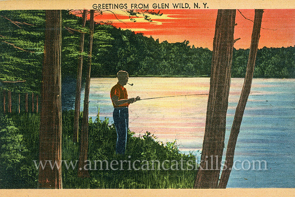 This vintage postcard titled “Greetings from Glen Wild, N.Y.” depicts a man fishing on a beautiful lakeshore while the sun sets with vivid colors.
