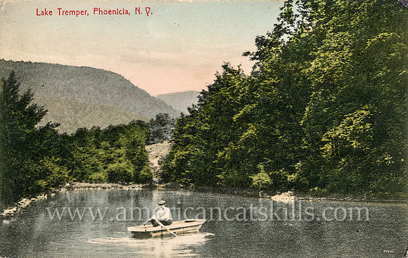 A young man peacefully boats across the lake in this vintage Catskills postcard titled “Lake Tremper, Phoenicia, N.Y.”