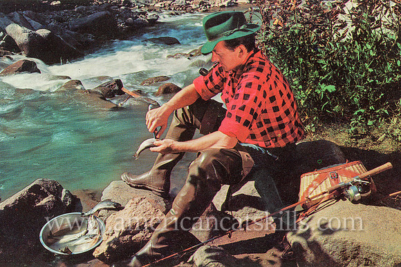 Vintage Catskills postcard titled “Preparing a Feast!” depicting a fisherman at the riverside with his catch.