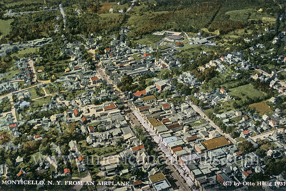 Vintage postcard by photographer Otto Hillig that depicts an aerial view of the village of Monticello in Sullivan County, New York.