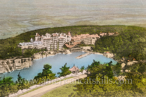 Vintage postcard that beautifully shows the Mohonk Mountain House as it sits atop the cliffs of Lake Mohonk in the Shawangunk Mountains.