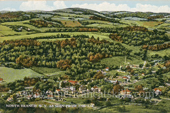 Vintage postcard from photographer Otto Hillig that shows the hamlet of North Branch in Sullivan County, New York from the air.