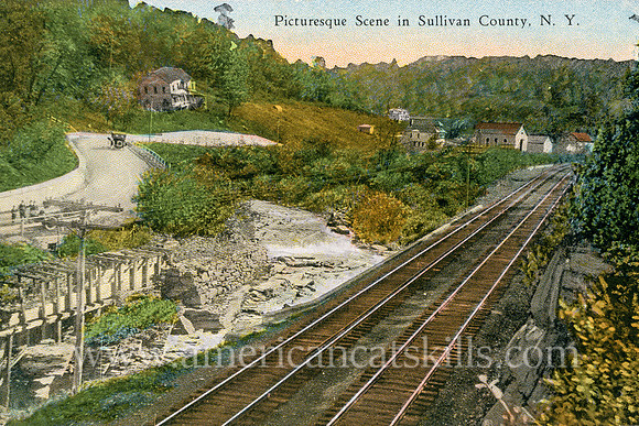 Vintage postcard from photographer Otto Hillig depicting a beautiful country scene including a road, a river, several houses and railroad tracks.
