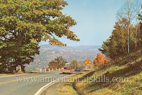 Vintage postcard from photographer Bob Wyer showing a scene along Route 28 near Franklin Mountain.
