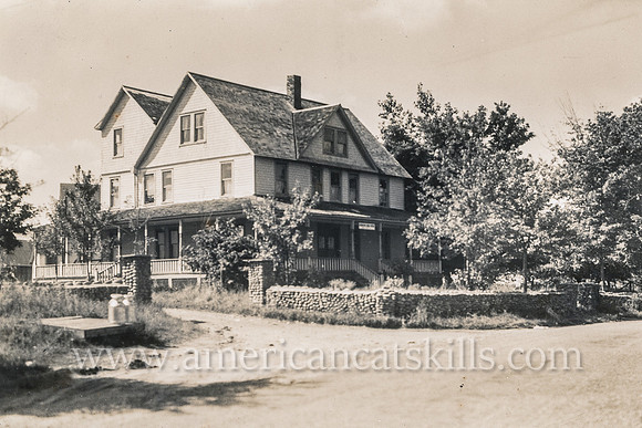 Vintage, untitled postcard by photographer Otto Hillig showing a quaint boarding house.