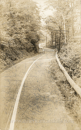 Vintage, untitled postcard by photographer Otto Hillig showing three girls playfully walking down an empty country road.