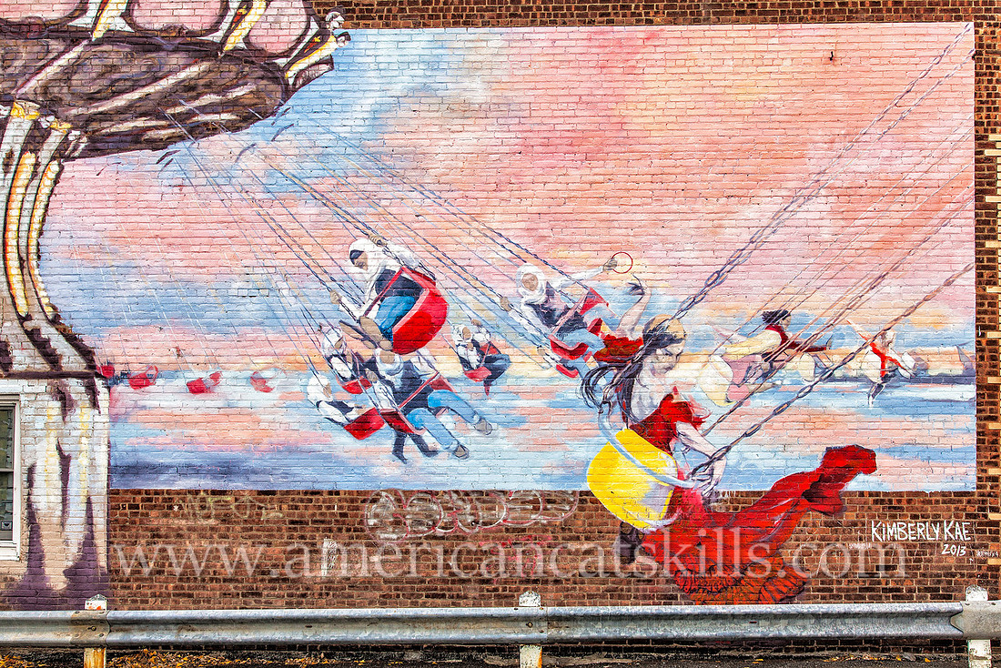 Carousel mural painted by Kimberly Kae in the Stockade District of Kingston during the annual O+ festival.