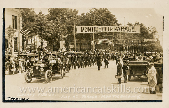 Vintage postcard titled "Liberty Fire Co., July 4th Parade, Monticello, N. Y." published by photographer Howard P. Thompson of Monticello, New York.
