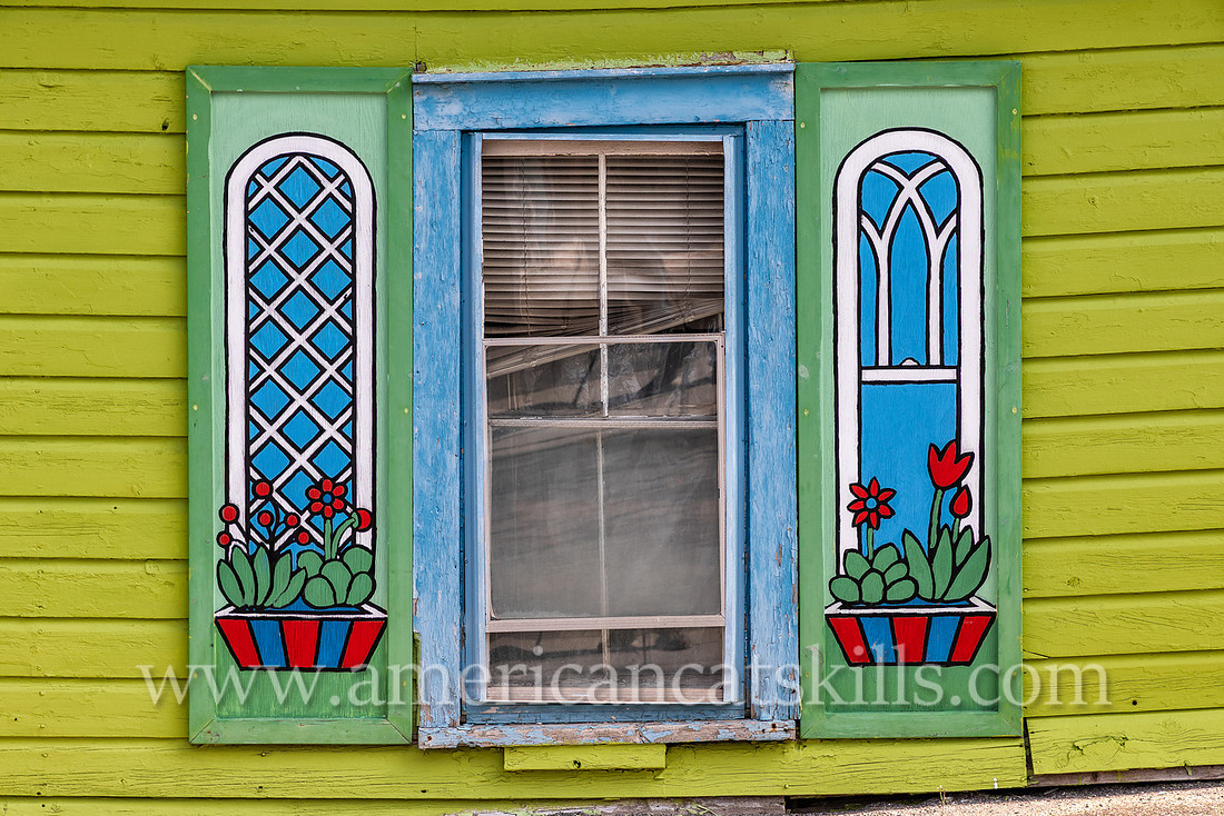 Photograph of painted, artistic house shutters in the northern Catskill village of Tannersville, New York.