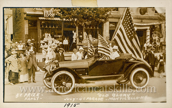 Vintage postcard titled "Old Glory, 5th Prize - Fancy, July 4th Parade, 1915, Monticello, N. Y." published by photographer Howard P. Thompson of Monticello, New York.