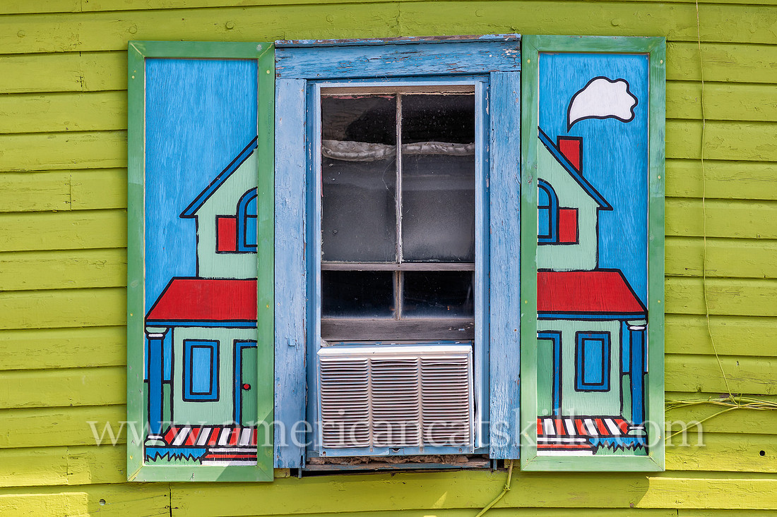 Photograph of painted, artistic house shutters in the northern Catskill village of Tannersville, New York.