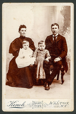 Family portrait taken by photographer H. J. Kinch of Walton, New York.
