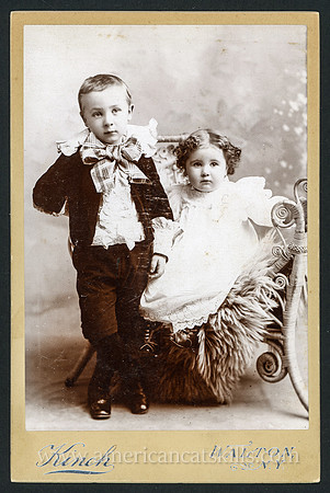 Portrait of two young children taken by the Kinch Brothers photographers of Walton, New York.