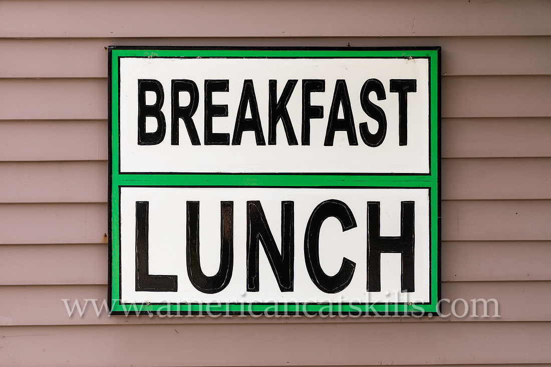 Photograph of a sign for breakfast and lunch in the northern Catskills village of Tannersville, New York.