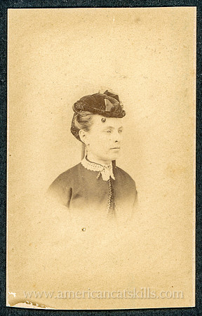 Portrait of a woman wearing a hat taken by photographer George A. Vallet of Kingston, New York