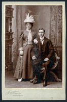 Portrait of a well-dressed young couple taken by photographer T. D. Lewis of Kingston, New York.