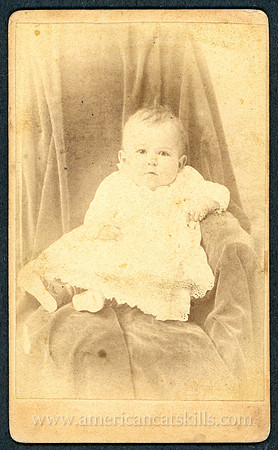 Portrait of a baby taken by photographer T. D. Lewis of Kingston, New York.